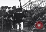 Image of Sightseers look at zeppelin wreckage displayed on dock  Salonica Greece, 1916, second 52 stock footage video 65675025842