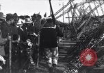Image of Sightseers look at zeppelin wreckage displayed on dock  Salonica Greece, 1916, second 53 stock footage video 65675025842