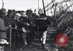 Image of Sightseers look at zeppelin wreckage displayed on dock  Salonica Greece, 1916, second 54 stock footage video 65675025842