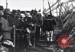Image of Sightseers look at zeppelin wreckage displayed on dock  Salonica Greece, 1916, second 55 stock footage video 65675025842