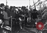Image of Sightseers look at zeppelin wreckage displayed on dock  Salonica Greece, 1916, second 56 stock footage video 65675025842