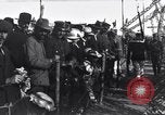 Image of Sightseers look at zeppelin wreckage displayed on dock  Salonica Greece, 1916, second 58 stock footage video 65675025842