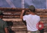 Image of Soldiers building a mess hall Vietnam, 1967, second 14 stock footage video 65675025930