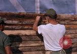 Image of Soldiers building a mess hall Vietnam, 1967, second 15 stock footage video 65675025930