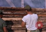Image of Soldiers building a mess hall Vietnam, 1967, second 16 stock footage video 65675025930