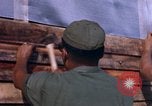 Image of Soldiers building a mess hall Vietnam, 1967, second 23 stock footage video 65675025930