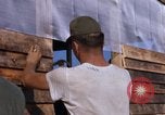 Image of Soldiers building a mess hall Vietnam, 1967, second 29 stock footage video 65675025930