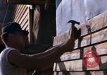 Image of Soldiers building a mess hall Vietnam, 1967, second 32 stock footage video 65675025930