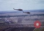 Image of UH-1H helicopters in Mekong Delta of Vietnam Vietnam, 1969, second 28 stock footage video 65675025967