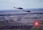 Image of UH-1H helicopters in Mekong Delta of Vietnam Vietnam, 1969, second 29 stock footage video 65675025967