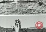 Image of women bathers sliding headfirst down a slide into a lake United States USA, 1940, second 3 stock footage video 65675026047