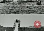 Image of women bathers sliding headfirst down a slide into a lake United States USA, 1940, second 4 stock footage video 65675026047