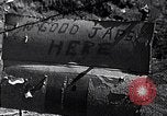 Image of Fallen Japanese soldiers among rocks Iwo Jima, 1945, second 1 stock footage video 65675026273