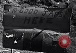 Image of Fallen Japanese soldiers among rocks Iwo Jima, 1945, second 3 stock footage video 65675026273