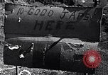 Image of Fallen Japanese soldiers among rocks Iwo Jima, 1945, second 7 stock footage video 65675026273
