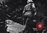 Image of Fallen Japanese soldiers among rocks Iwo Jima, 1945, second 17 stock footage video 65675026273