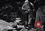 Image of Fallen Japanese soldiers among rocks Iwo Jima, 1945, second 19 stock footage video 65675026273