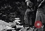 Image of Fallen Japanese soldiers among rocks Iwo Jima, 1945, second 21 stock footage video 65675026273