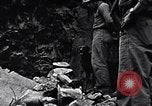 Image of Fallen Japanese soldiers among rocks Iwo Jima, 1945, second 22 stock footage video 65675026273