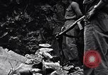 Image of Fallen Japanese soldiers among rocks Iwo Jima, 1945, second 23 stock footage video 65675026273