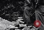 Image of Fallen Japanese soldiers among rocks Iwo Jima, 1945, second 25 stock footage video 65675026273