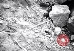 Image of Fallen Japanese soldiers among rocks Iwo Jima, 1945, second 27 stock footage video 65675026273