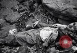 Image of Fallen Japanese soldiers among rocks Iwo Jima, 1945, second 45 stock footage video 65675026273