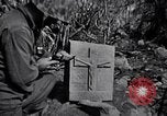Image of Fallen Japanese soldiers among rocks Iwo Jima, 1945, second 58 stock footage video 65675026273