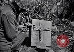 Image of Fallen Japanese soldiers among rocks Iwo Jima, 1945, second 59 stock footage video 65675026273