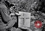 Image of Fallen Japanese soldiers among rocks Iwo Jima, 1945, second 60 stock footage video 65675026273