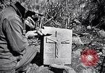 Image of Fallen Japanese soldiers among rocks Iwo Jima, 1945, second 62 stock footage video 65675026273