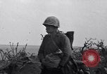Image of Marines moving along a ridge Iwo Jima, 1945, second 4 stock footage video 65675026281