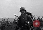 Image of Marines moving along a ridge Iwo Jima, 1945, second 8 stock footage video 65675026281