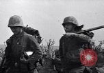 Image of Marines moving along a ridge Iwo Jima, 1945, second 9 stock footage video 65675026281