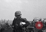 Image of Marines moving along a ridge Iwo Jima, 1945, second 14 stock footage video 65675026281