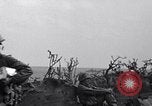 Image of Marines moving along a ridge Iwo Jima, 1945, second 15 stock footage video 65675026281