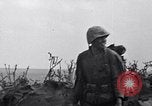 Image of Marines moving along a ridge Iwo Jima, 1945, second 18 stock footage video 65675026281