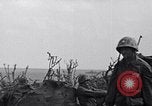 Image of Marines moving along a ridge Iwo Jima, 1945, second 22 stock footage video 65675026281