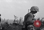 Image of Marines moving along a ridge Iwo Jima, 1945, second 24 stock footage video 65675026281