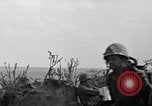Image of Marines moving along a ridge Iwo Jima, 1945, second 25 stock footage video 65675026281