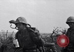 Image of Marines moving along a ridge Iwo Jima, 1945, second 26 stock footage video 65675026281