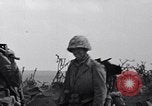 Image of Marines moving along a ridge Iwo Jima, 1945, second 27 stock footage video 65675026281