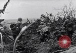 Image of Marines clearing Japanese defenders from a ridge Iwo Jima, 1945, second 32 stock footage video 65675026282