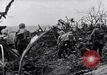 Image of Marines clearing Japanese defenders from a ridge Iwo Jima, 1945, second 33 stock footage video 65675026282