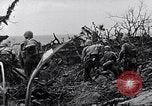 Image of Marines clearing Japanese defenders from a ridge Iwo Jima, 1945, second 34 stock footage video 65675026282