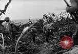 Image of Marines clearing Japanese defenders from a ridge Iwo Jima, 1945, second 43 stock footage video 65675026282