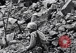 Image of Marines clearing Japanese defenders from a ridge Iwo Jima, 1945, second 59 stock footage video 65675026282