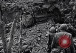 Image of US Marines look for remaining Japanese defenders Iwo Jima, 1945, second 4 stock footage video 65675026283