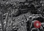 Image of US Marines look for remaining Japanese defenders Iwo Jima, 1945, second 6 stock footage video 65675026283