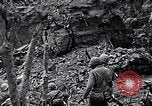 Image of US Marines look for remaining Japanese defenders Iwo Jima, 1945, second 7 stock footage video 65675026283